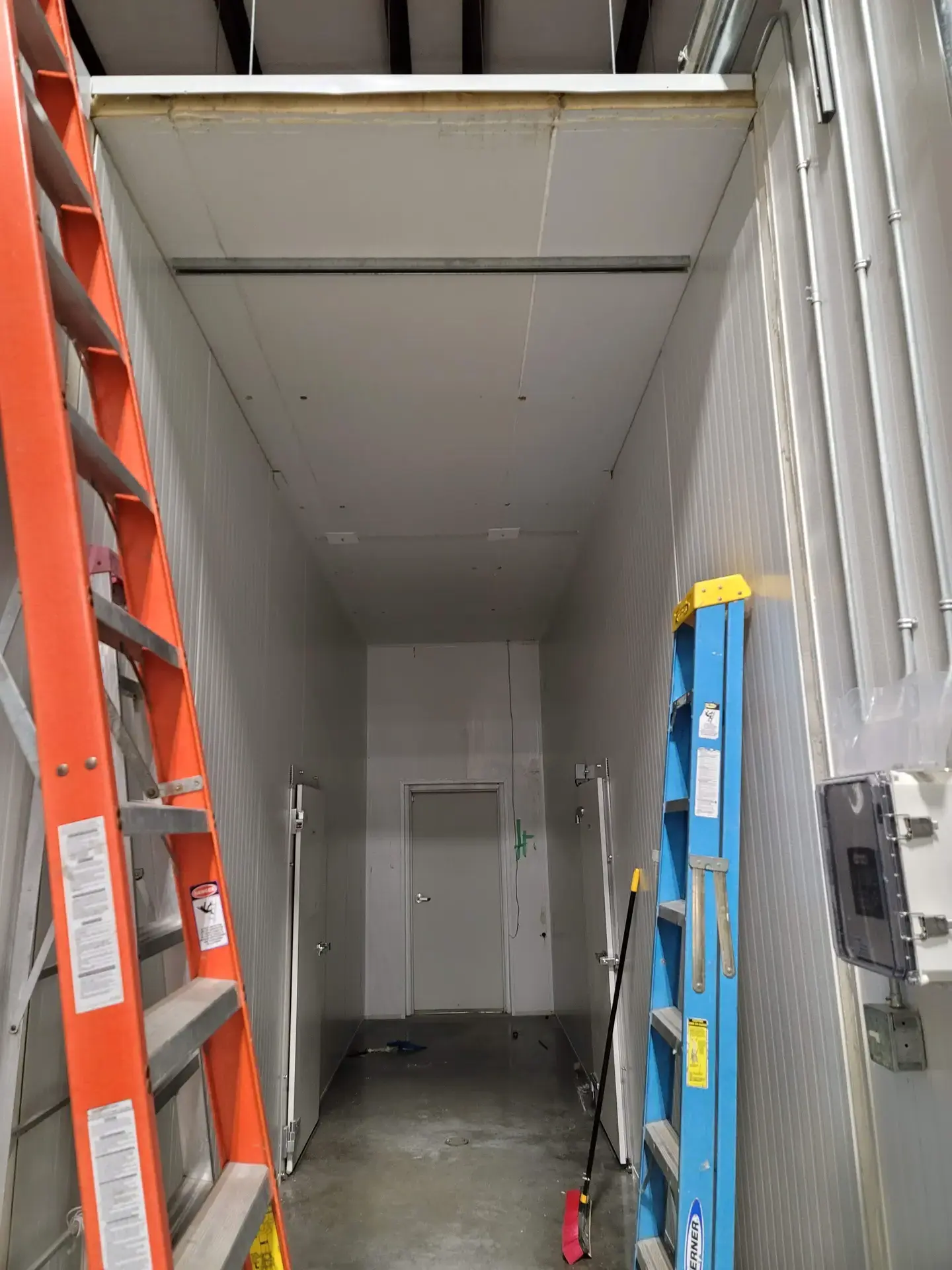 Large walk-in cooler interior partway through installation